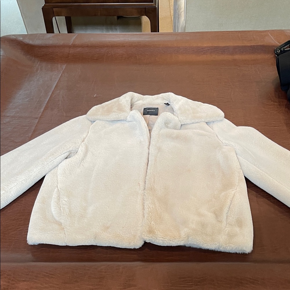 Theory woman’s off white faux fur jacket. Size Large. 4 clasp closures.